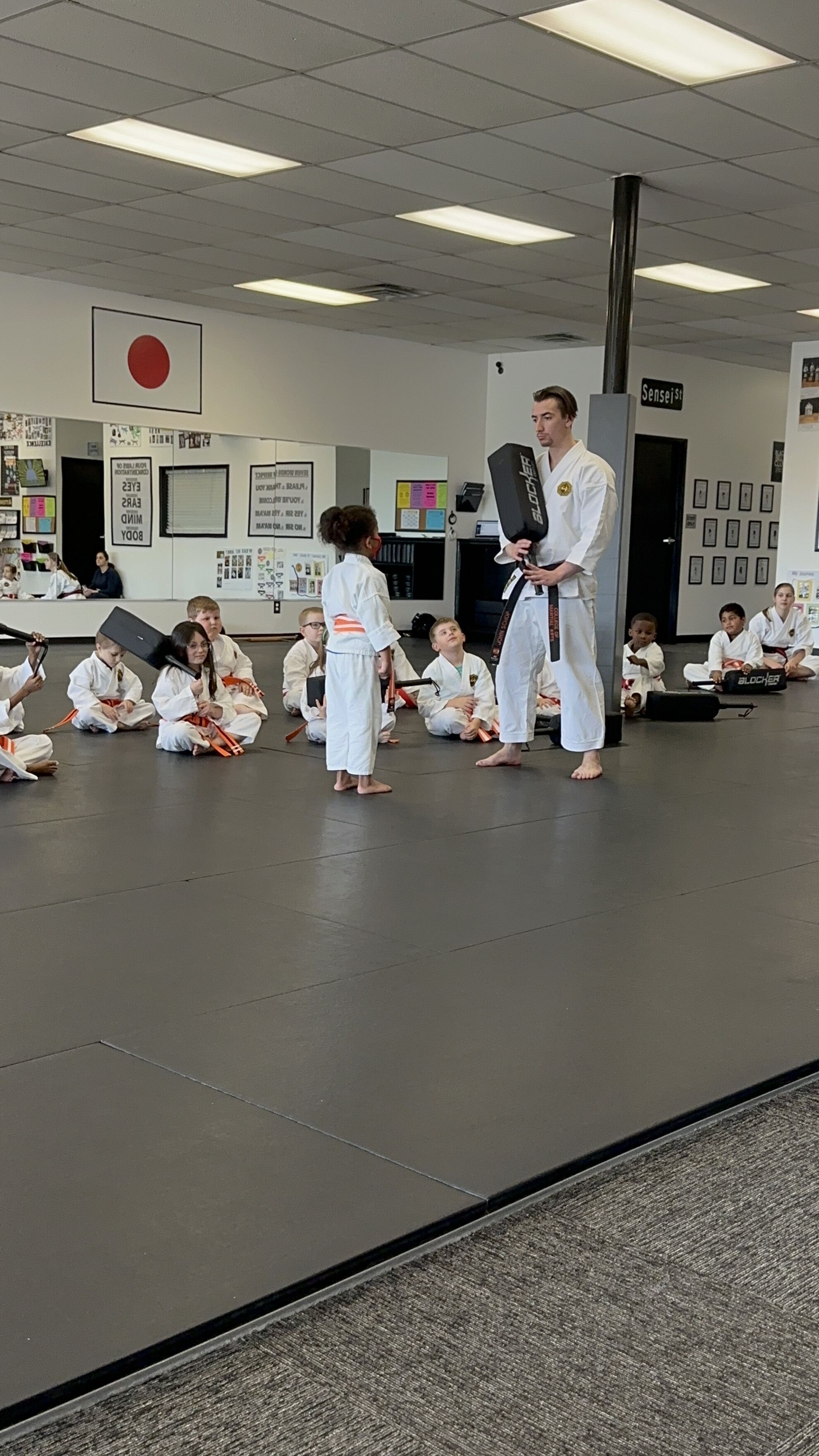 Liam helping instructor with demonstration